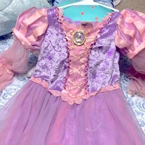 A Disney princess dress for kids size 5 and a 6